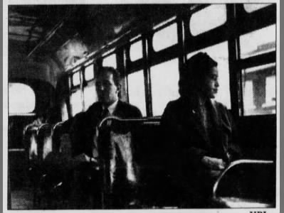 Rosa Parks in the front of a bus Dec 21, 1956
